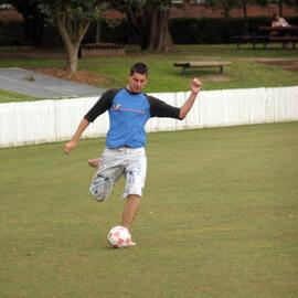Students Playing Soccer on Village Green