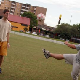 Students Playing Soccer on Village Green