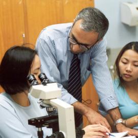 Students at Microscopes with Rakesh Kumar, Faculty of Medicine
