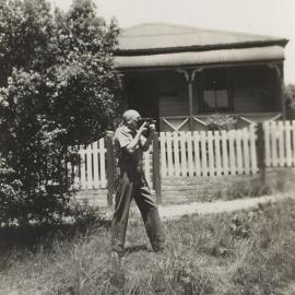 John Clancy using a film camera at Blackheath