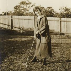 Nell Buckland playing golf