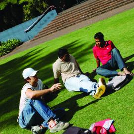 Students on Michael Birt Gardens Lawn in front of Biological Sciences Building