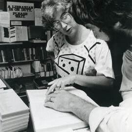 Library - Pat Howard assisting David Beslich