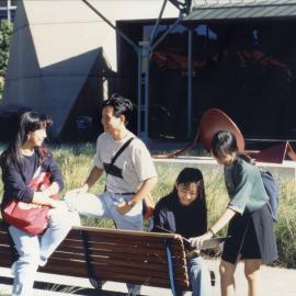Students in Michael Birt Gardens near John Clancy Auditorium