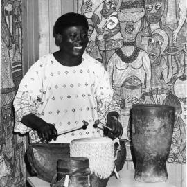 Nigerian Artist Performing on Drums in the John Clark Gallery. 