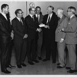 Prof. Baxter Receiving a Cheque