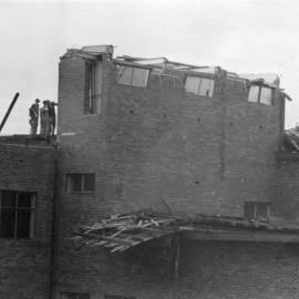 Storm damage to roof of first permanent (Main) building. 