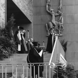 Professor Albert Alexander announcing a graduate