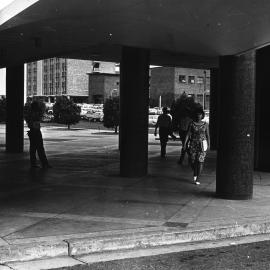 Students passing by the colonnade below the Dalton Building.