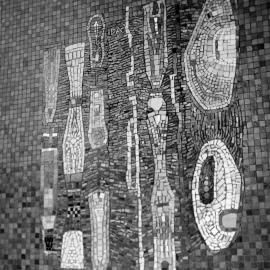 Mural / mosaic in tiles with the artist's initials 