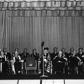 Robert J. Webster at the lectern on the dais
