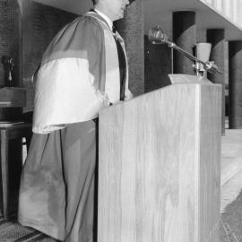 Sir Eric Woodward at the lectern