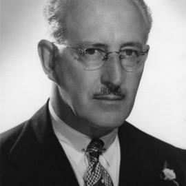 Head to shoulders studio portrait - Dr Robert K. Murphy.